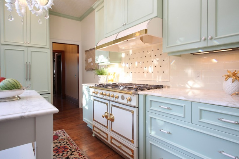 Traditional kitchen in Portland with recessed-panel cabinets, beige splashback, ceramic splashback and panelled appliances.