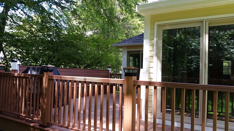 This is an example of a mid-sized traditional backyard deck in Boston.