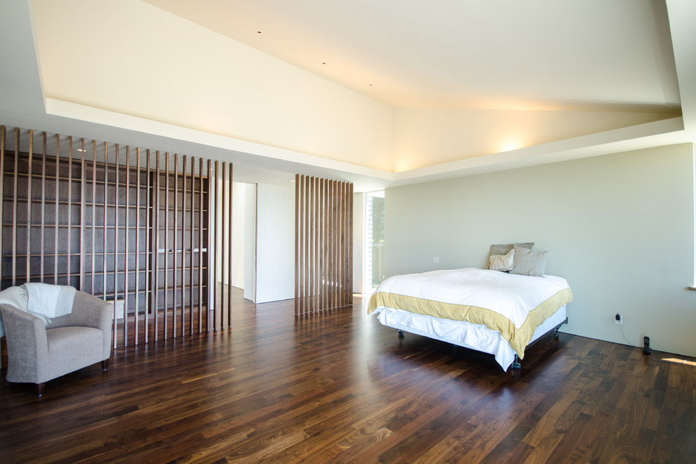 Inspiration for a contemporary master bedroom in San Francisco with white walls, dark hardwood floors and no fireplace.