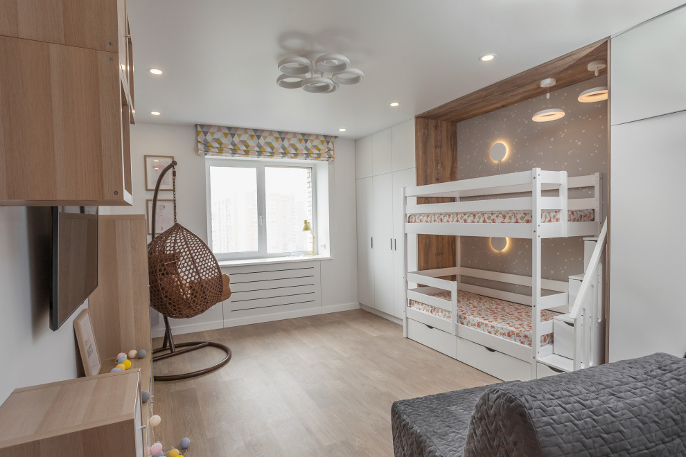 Inspiration for a medium sized contemporary gender neutral kids' bedroom in Saint Petersburg with white walls, light hardwood flooring, beige floors, wallpapered walls and feature lighting.