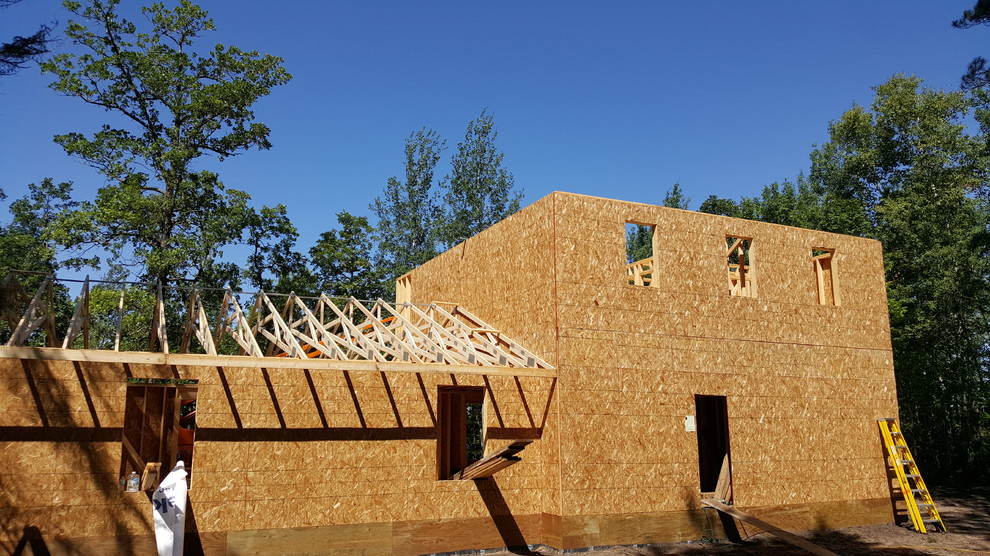 Example of a mountain style concrete fiberboard multicolored home design design in Minneapolis