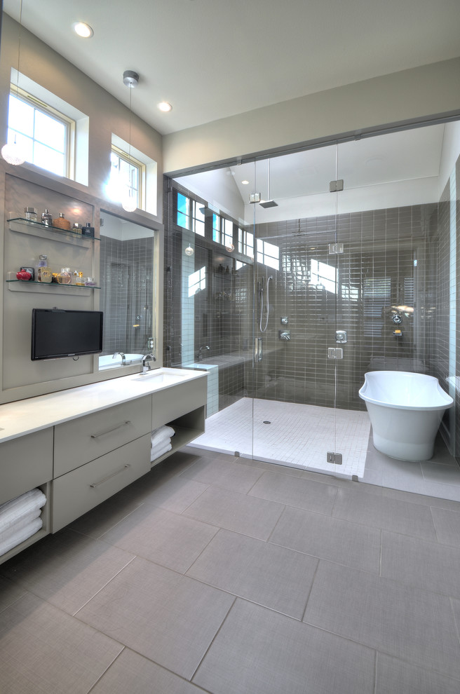 This is an example of a contemporary bathroom in Dallas with a freestanding tub and a shower seat.