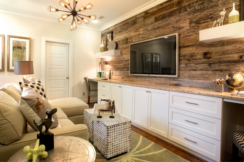 Design ideas for a country family room in Birmingham with light hardwood floors and a wall-mounted tv.