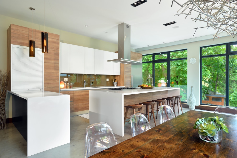 Contemporary kitchen in Toronto with flat-panel cabinets, medium wood cabinets, quartzite benchtops, brown splashback, stone slab splashback, stainless steel appliances, with island, a single-bowl sink and concrete floors.