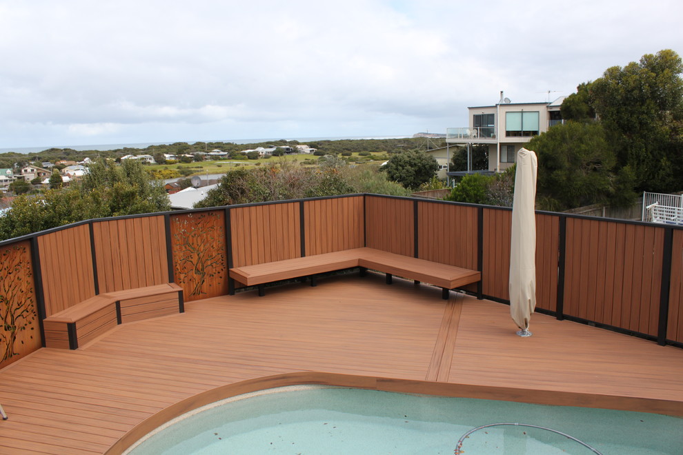 This is an example of a large scandinavian backyard deck in Melbourne with an outdoor shower.