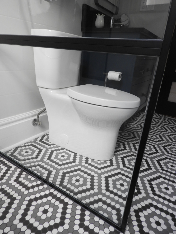 Design ideas for a small industrial 3/4 bathroom in Toronto with shaker cabinets, blue cabinets, a curbless shower, a two-piece toilet, white tile, ceramic tile, white walls, mosaic tile floors, an undermount sink, engineered quartz benchtops, grey floor, an open shower, black benchtops, a niche, a single vanity and a built-in vanity.