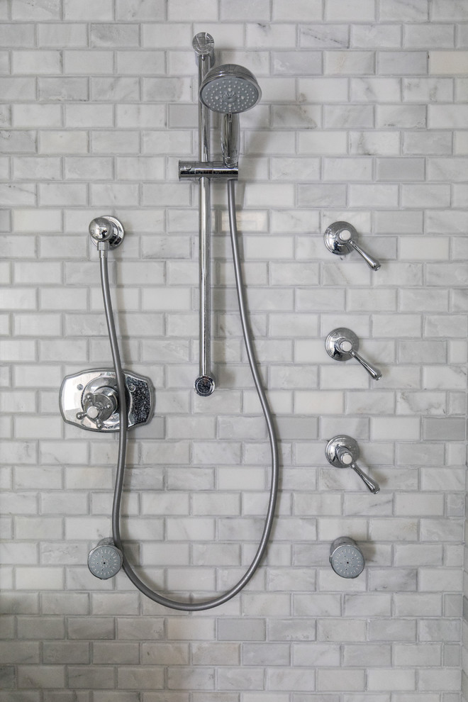 Example of a transitional home design design in Calgary