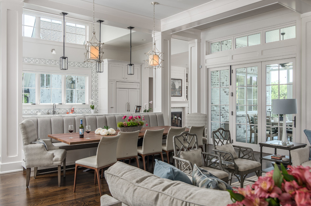 Design ideas for a transitional open plan dining in Nashville with white walls and dark hardwood floors.