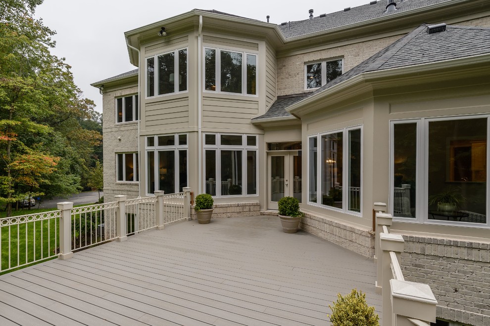 Large transitional backyard patio photo in DC Metro with decking and no cover