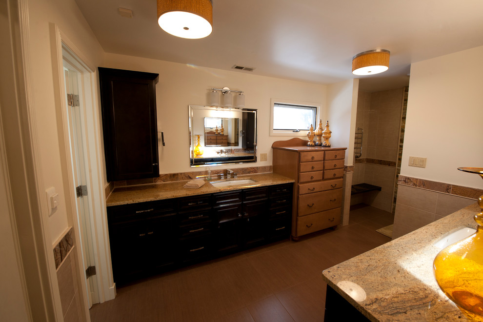 Inspiration for a large transitional master brown tile and ceramic tile ceramic tile alcove shower remodel in Indianapolis with an undermount sink, recessed-panel cabinets, black cabinets, granite countertops, a two-piece toilet and beige walls