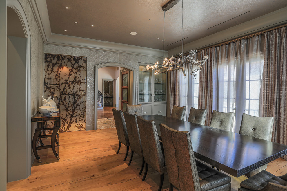 Inspiration for a contemporary separate dining room in Dallas with grey walls, light hardwood floors and no fireplace.