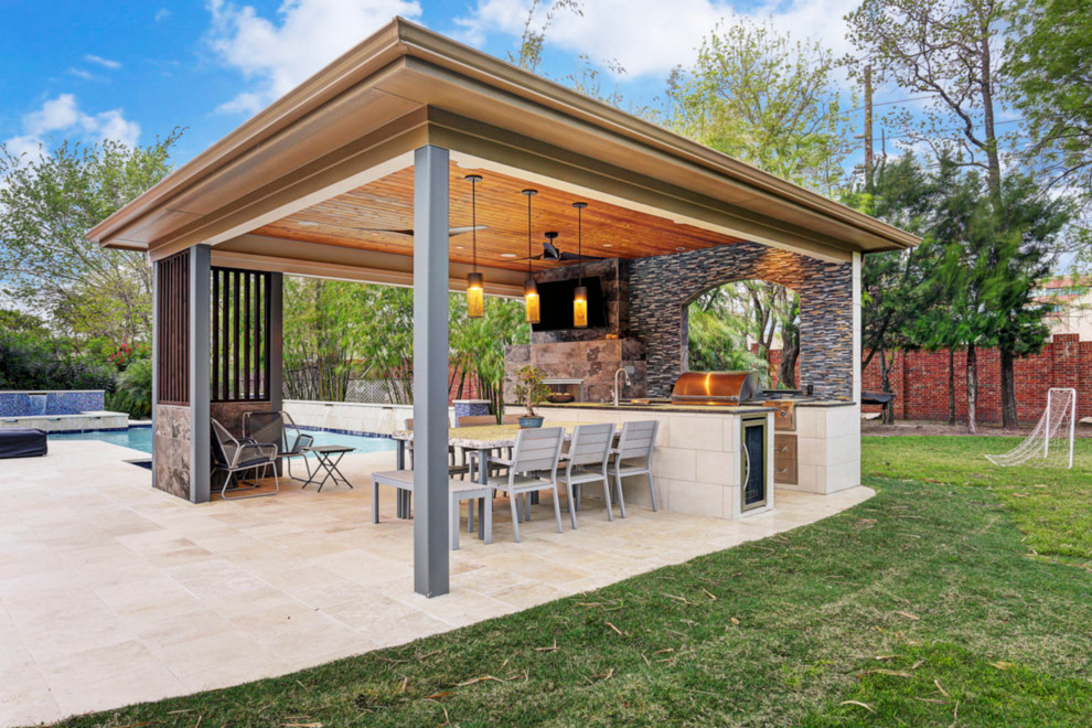 This is an example of a mid-sized contemporary backyard patio in Houston with an outdoor kitchen, tile and a gazebo/cabana.