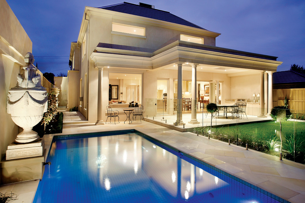 Inspiration for a mid-sized transitional backyard rectangular pool remodel in Melbourne