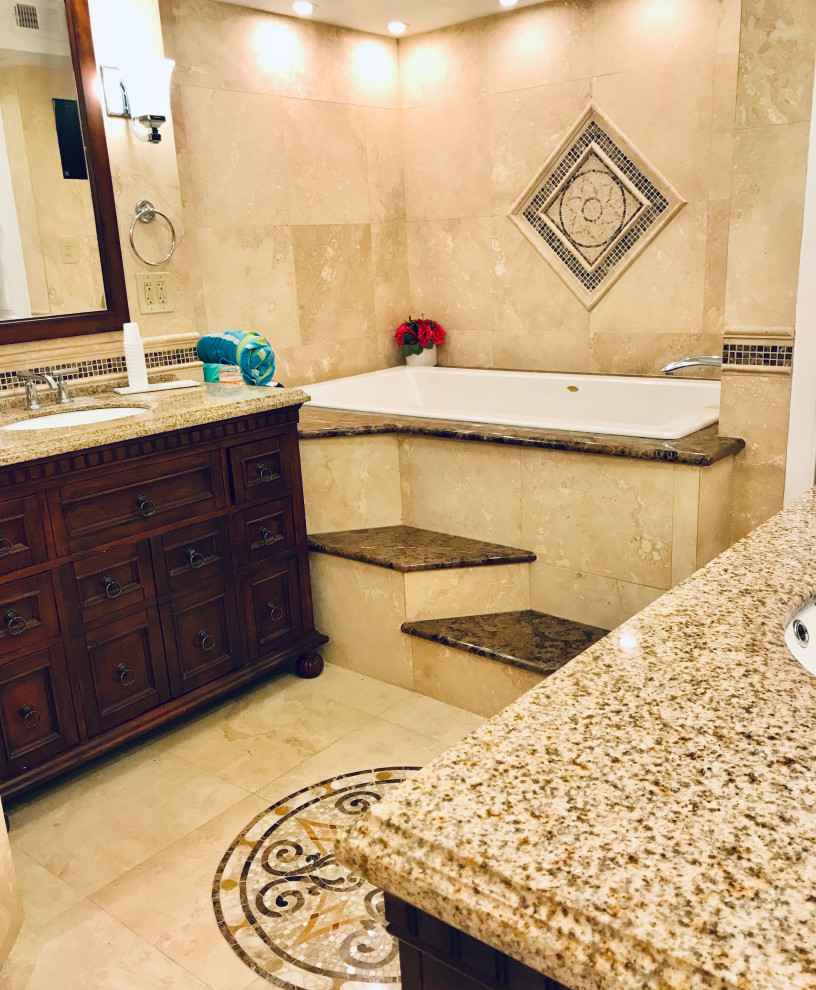 Inspiration for a mid-sized mediterranean bathroom in Other with furniture-like cabinets, brown cabinets, a hot tub, a corner shower, a one-piece toilet, beige tile, travertine, beige walls, travertine floors, an undermount sink, granite benchtops, beige floor, a shower curtain, beige benchtops, a single vanity and a built-in vanity.