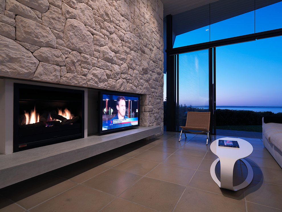 This is an example of a large contemporary open concept living room in Melbourne with a wall-mounted tv.