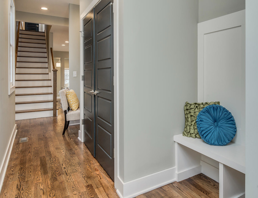 Photo of a mid-sized transitional entry hall in Nashville with grey walls and light hardwood floors.