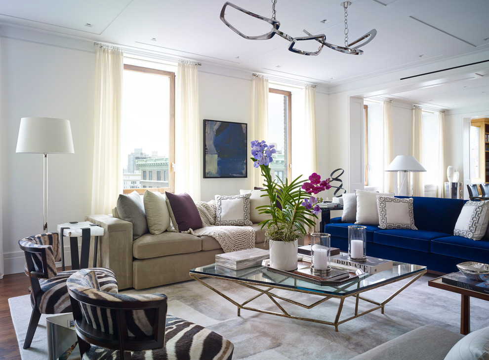 This is an example of a transitional formal open concept living room in New York with white walls and no fireplace.