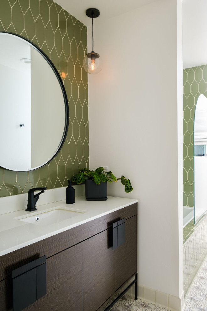 This is an example of a medium sized modern ensuite bathroom in San Francisco with green cabinets, green tiles, ceramic tiles, ceramic flooring, a built-in sink and an open shower.
