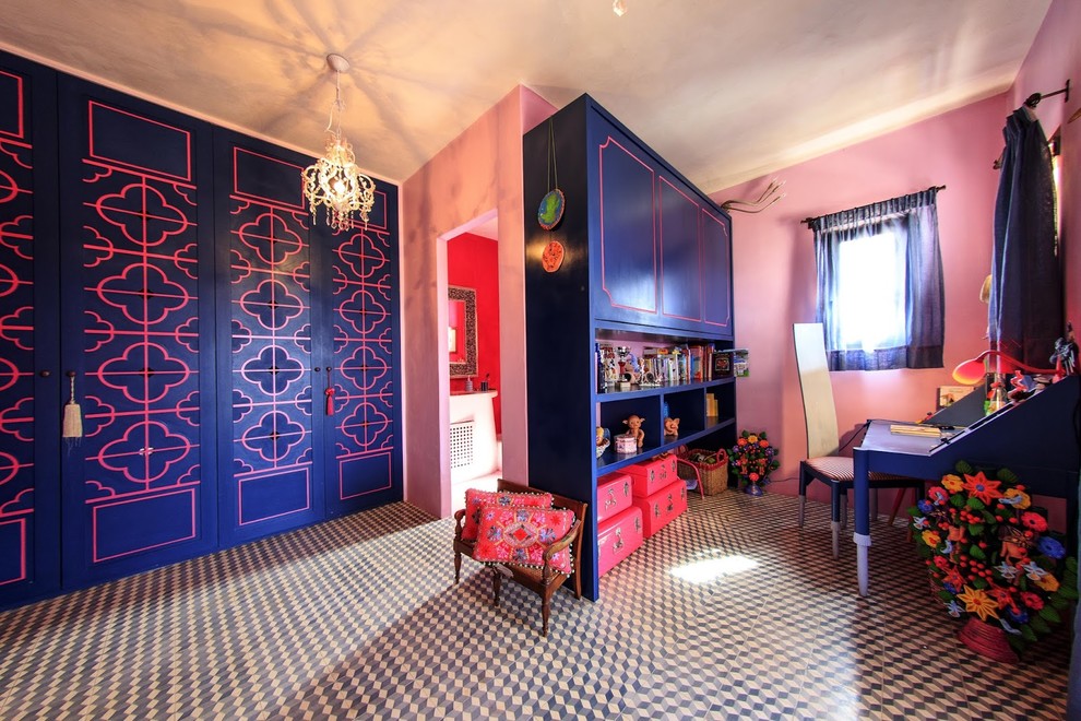 Photo of a mid-sized eclectic study room in Other with pink walls, ceramic floors, no fireplace and a built-in desk.