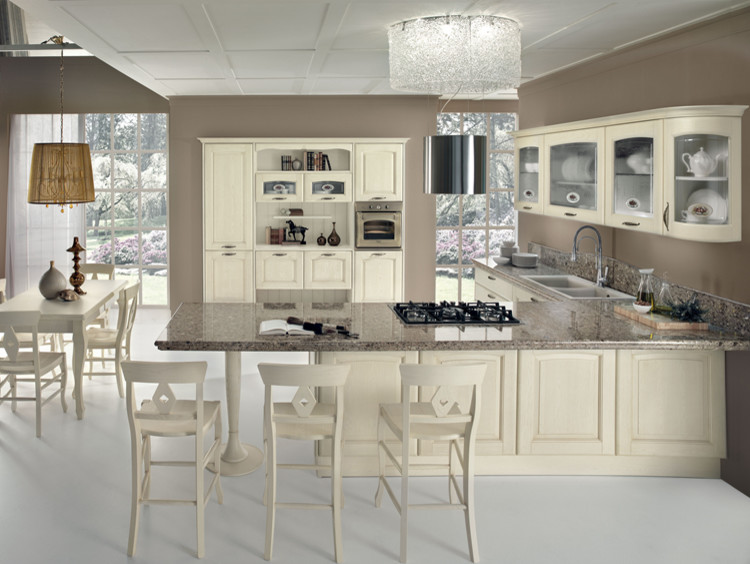Inspiration for a large contemporary l-shaped kitchen pantry in Other with a double-bowl sink, glass-front cabinets, beige cabinets, quartzite benchtops, white splashback, timber splashback, stainless steel appliances, no island and white floor.