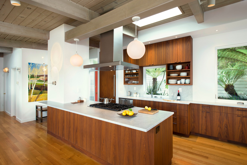 Inspiration for a mid-sized midcentury kitchen in San Francisco with flat-panel cabinets and light hardwood floors.