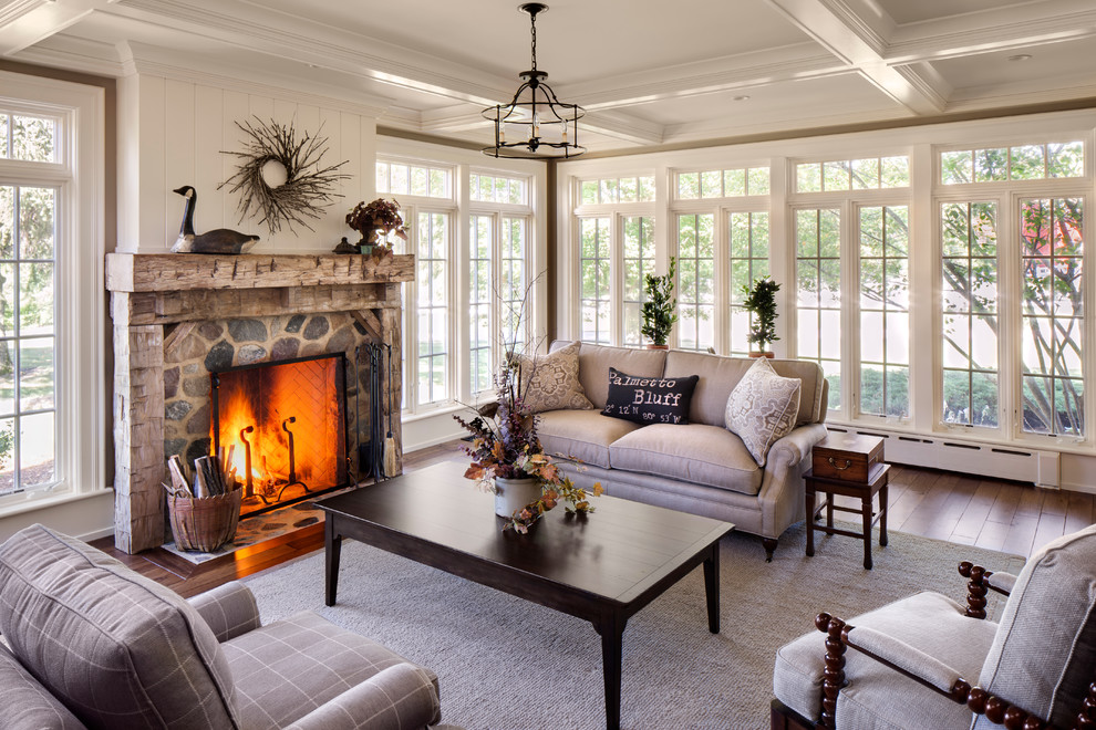Design ideas for a country living room in Milwaukee with white walls, a standard fireplace, a stone fireplace surround and no tv.