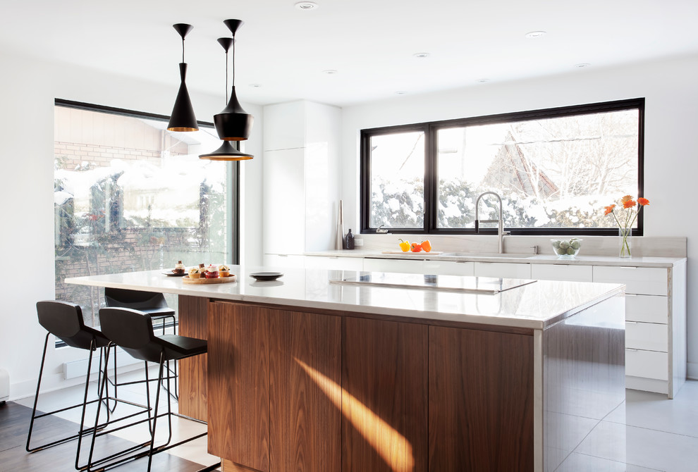 Photo of a large contemporary kitchen in Montreal with with island.