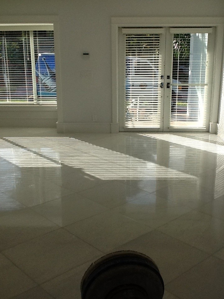 This is an example of a traditional dining room in Miami with marble floors.
