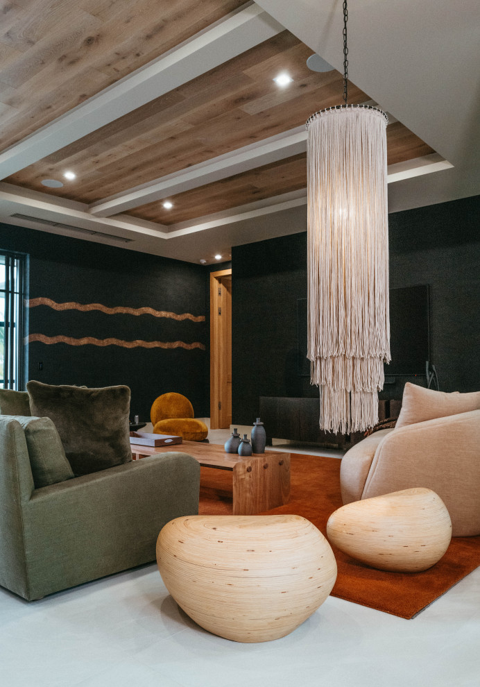 Example of an island style family room design in Miami