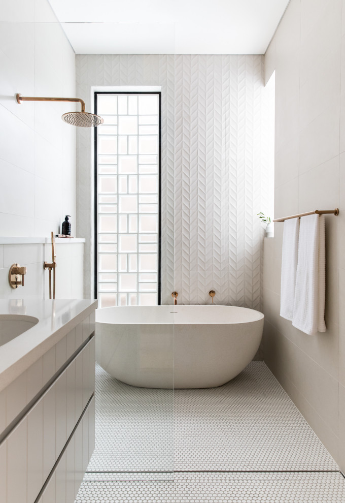 Mid-sized contemporary master wet room bathroom in Sydney with flat-panel cabinets, grey cabinets, a freestanding tub, white tile, porcelain tile, porcelain floors, an undermount sink, white floor, an open shower, beige benchtops, a single vanity and a floating vanity.