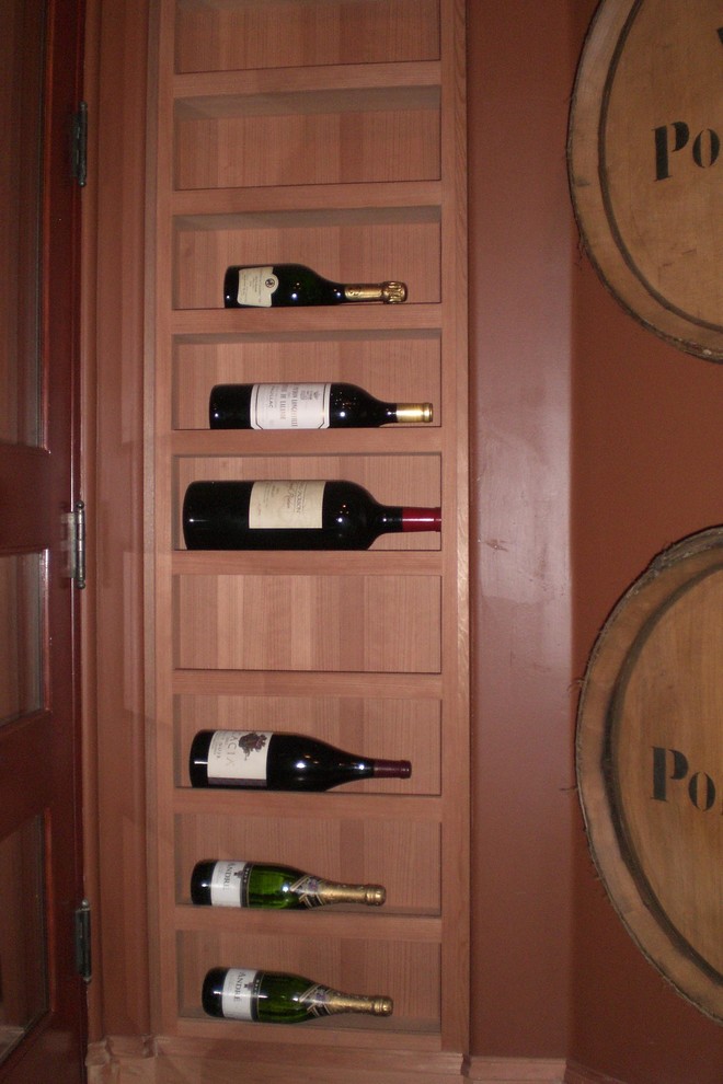 Inspiration for a small transitional wine cellar in Orange County with storage racks.