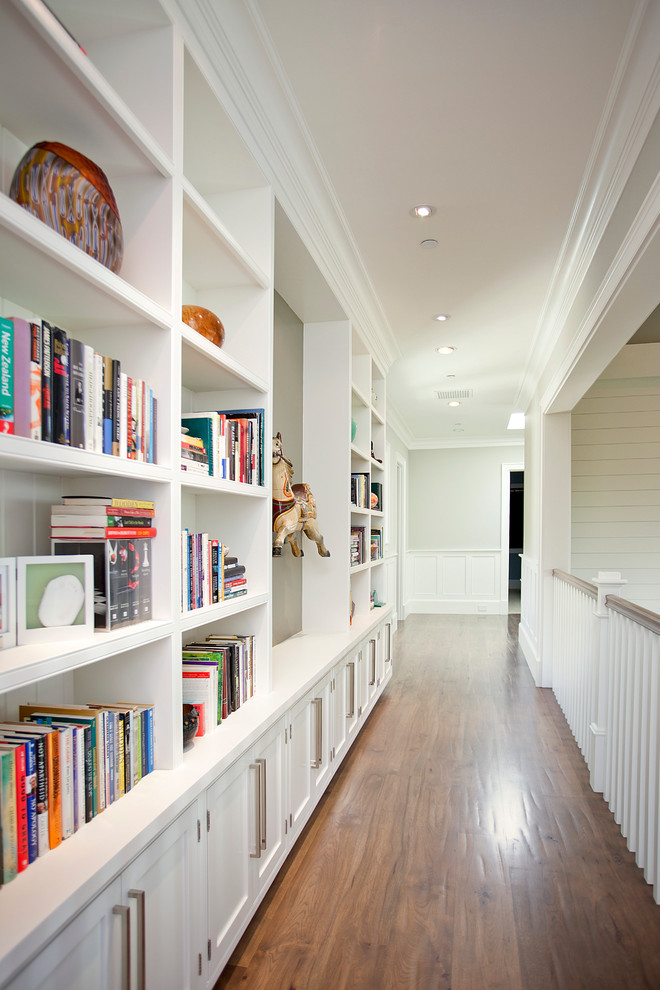 Inspiration for a contemporary hallway in Los Angeles with white walls and dark hardwood floors.