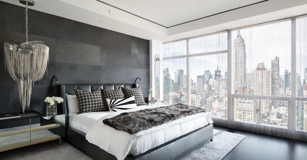 Contemporary master bedroom in New York with black walls and black floor.