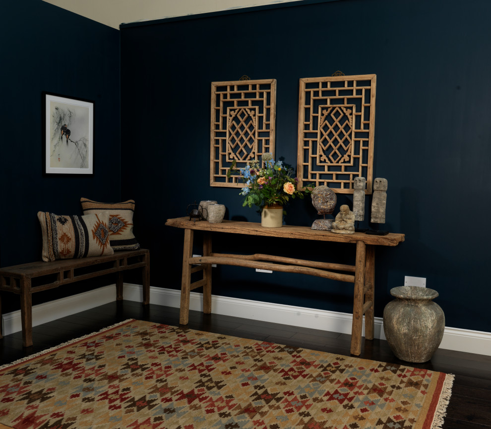 Inspiration for a mid-sized asian hallway in Other with blue walls, laminate floors and brown floor.