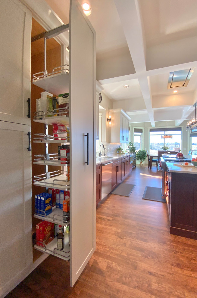 Example of a large transitional single-wall dark wood floor, brown floor and coffered ceiling kitchen pantry design in Calgary with shaker cabinets, gray cabinets, an undermount sink, quartzite countertops, multicolored backsplash, stone slab backsplash, stainless steel appliances, an island and multicolored countertops