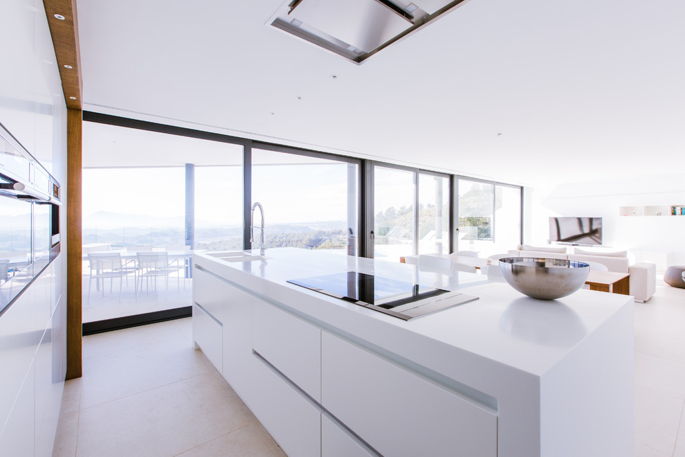 Expansive modern single-wall open plan kitchen in Alicante-Costa Blanca with flat-panel cabinets, white cabinets and with island.