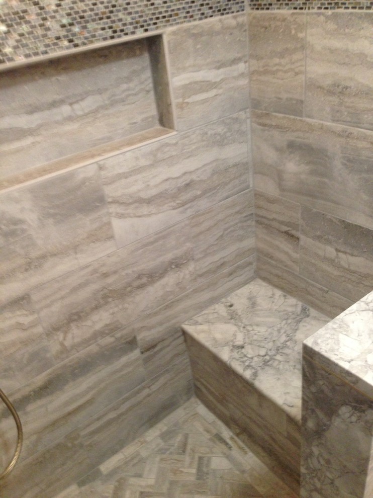 Inspiration for a small transitional 3/4 gray tile, white tile and porcelain tile porcelain tile doorless shower remodel in Baltimore with raised-panel cabinets, dark wood cabinets, a two-piece toilet, white walls, a vessel sink and quartzite countertops