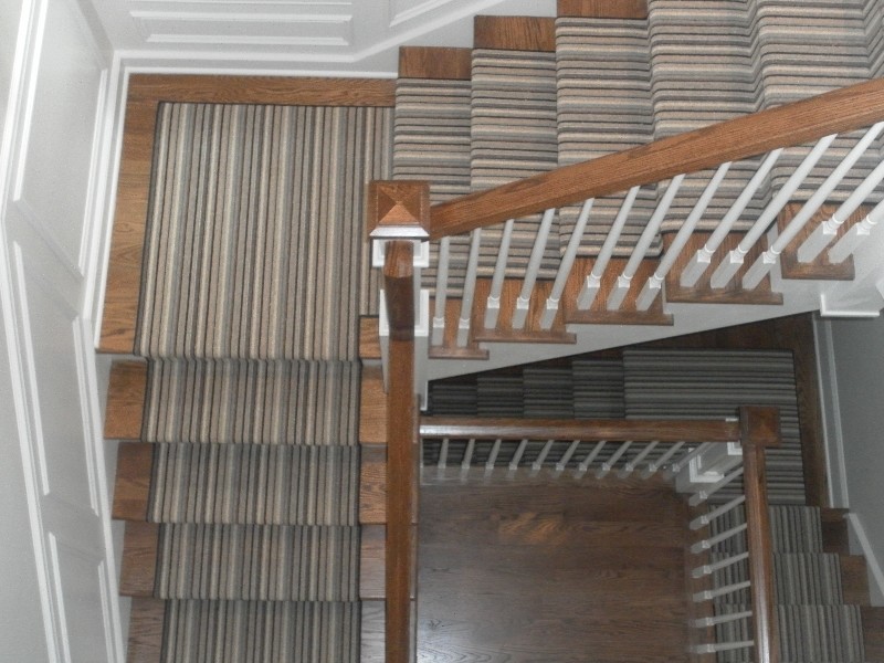 Transitional carpeted straight staircase photo in Chicago with wooden risers
