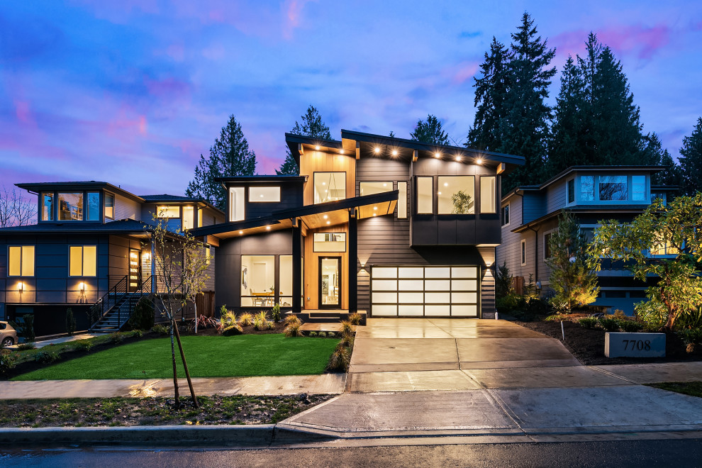 Großes, Zweistöckiges Modernes Einfamilienhaus mit Faserzement-Fassade, schwarzer Fassadenfarbe, Pultdach, Misch-Dachdeckung und schwarzem Dach in Seattle