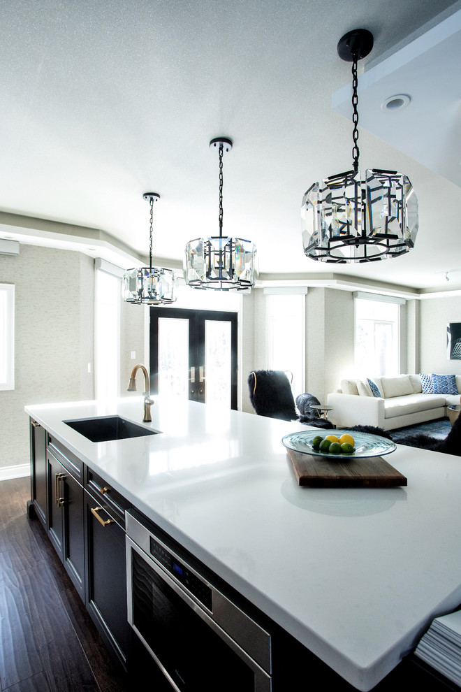 Inspiration for a modern kitchen remodel in Toronto with blue backsplash