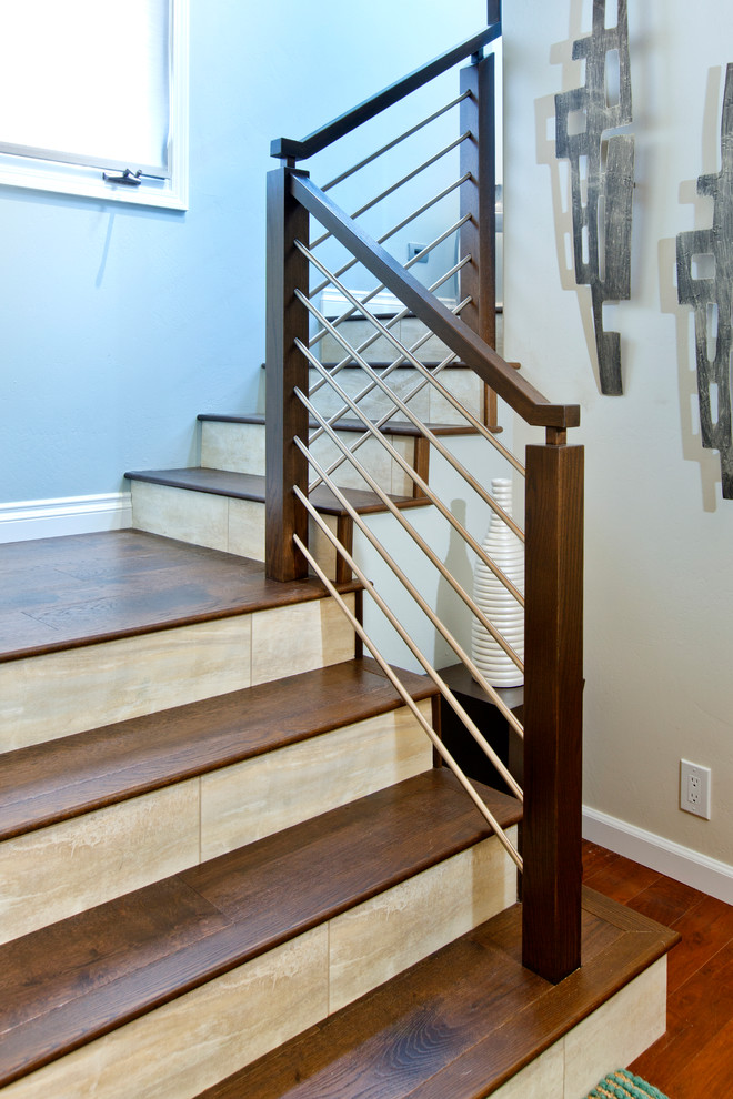 Inspiration for an expansive beach style wood l-shaped staircase in Tampa with tile risers.