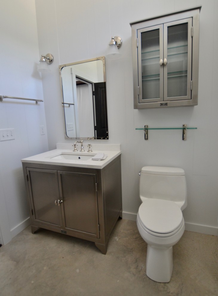 Design ideas for a small transitional bathroom in Austin with a two-piece toilet, white walls, concrete floors, an undermount sink, granite benchtops, beige floor, white benchtops, an enclosed toilet, a freestanding vanity and timber.