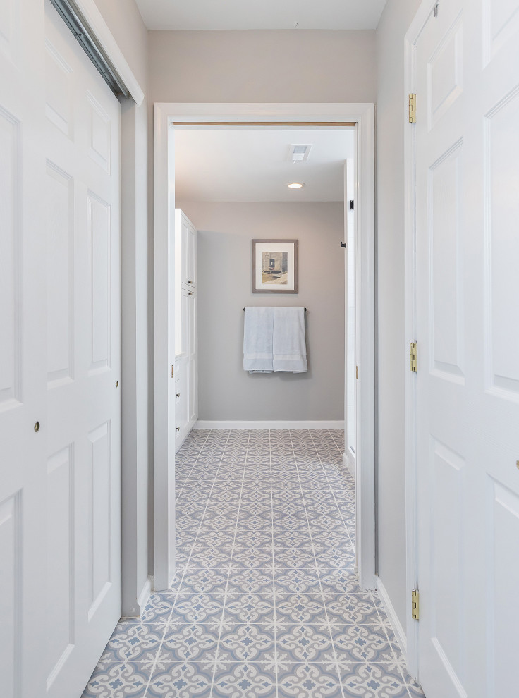 Design ideas for a mid-sized transitional master bathroom in Philadelphia with recessed-panel cabinets, white cabinets, a double shower, gray tile, subway tile, grey walls, mosaic tile floors, an undermount sink, blue floor, a sliding shower screen, a shower seat, a double vanity and a built-in vanity.