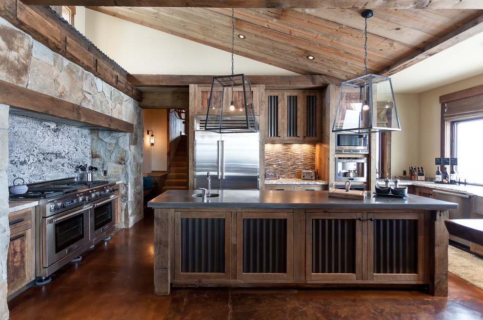 Example of a mountain style kitchen design in Sacramento with stone slab backsplash and an island