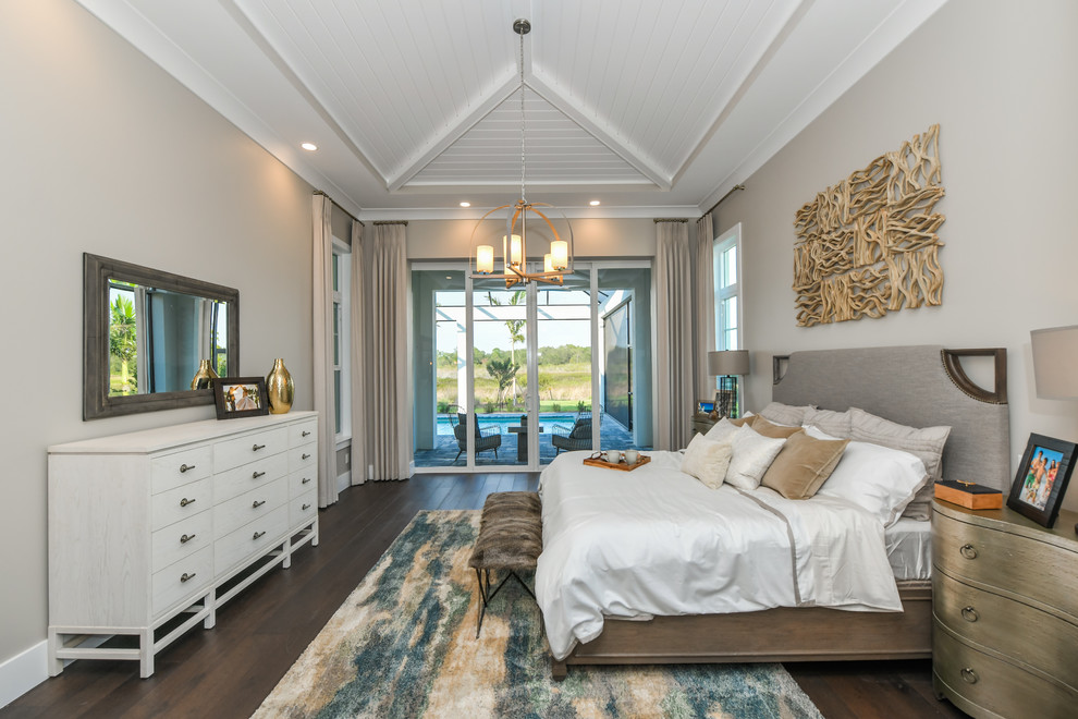 Transitional master bedroom in Tampa with beige walls, dark hardwood floors and brown floor.