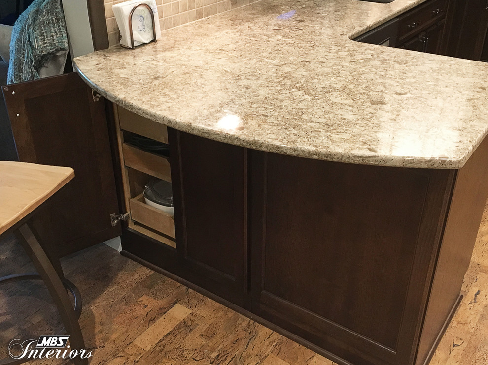 Inspiration for a small transitional u-shaped eat-in kitchen remodel with an undermount sink, recessed-panel cabinets, white cabinets, quartzite countertops, multicolored backsplash, mosaic tile backsplash, stainless steel appliances and no island