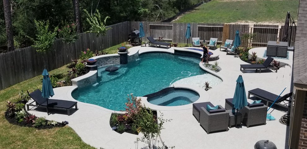 Design ideas for a contemporary custom-shaped pool in Houston with decking.