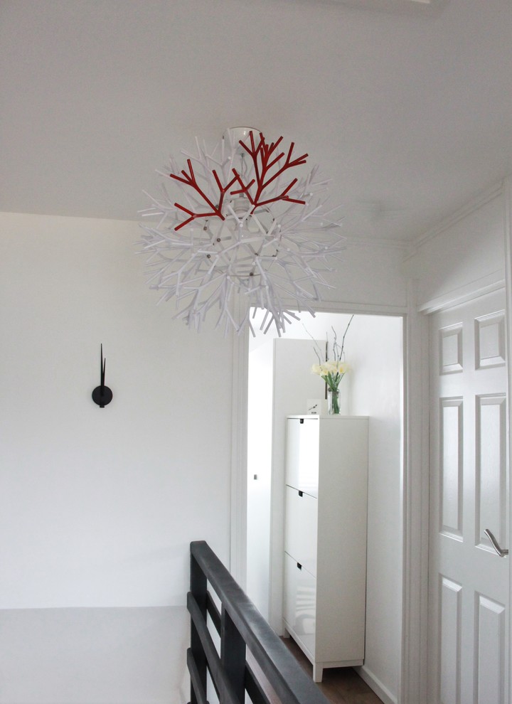 This is an example of a mid-sized modern hallway in Buckinghamshire with white walls.