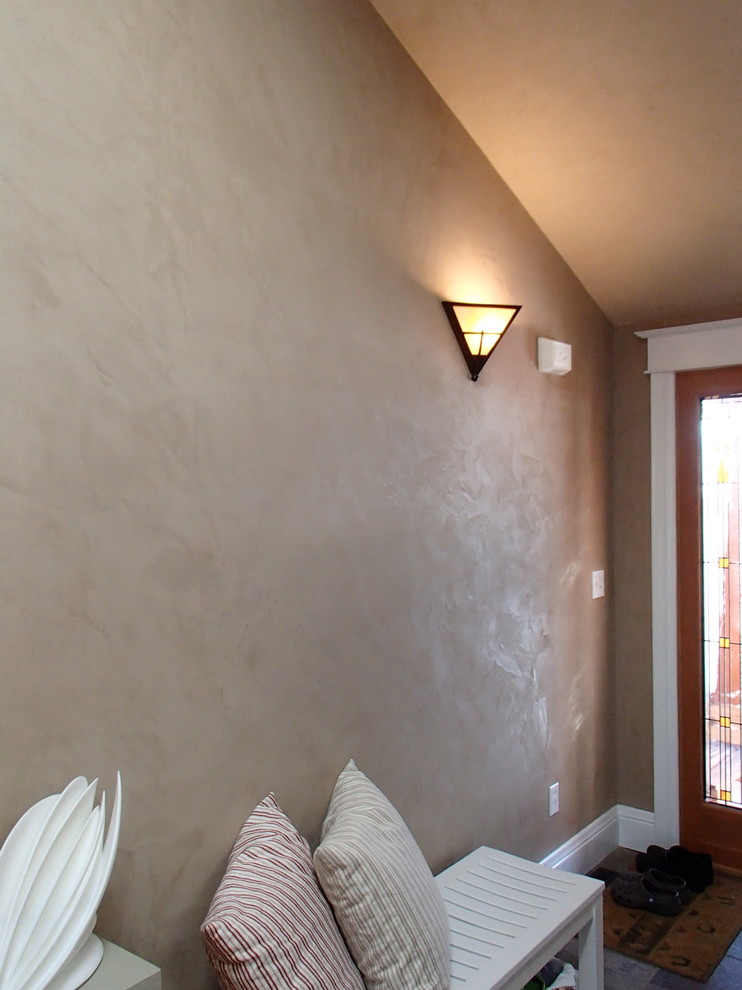 Foyer - mid-sized rustic foyer idea in Denver with beige walls and a glass front door