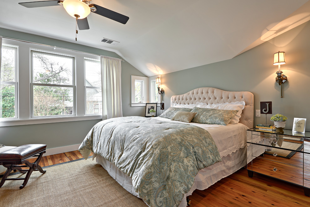 Large transitional master bedroom in Austin with blue walls, medium hardwood floors and no fireplace.